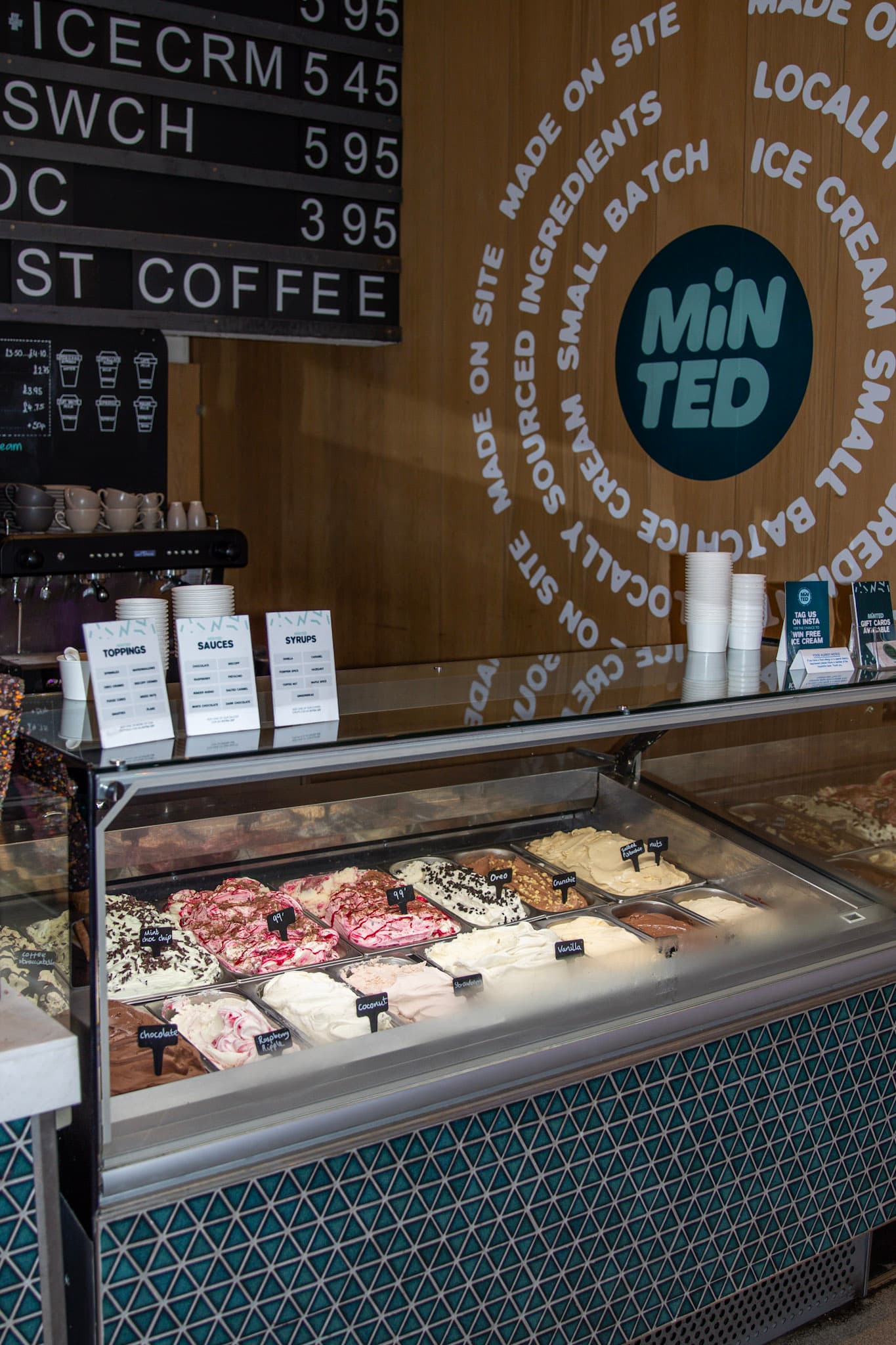Minted Ice Cream counter on Byres Road, with a glass case of flavour pans and an espresso machine